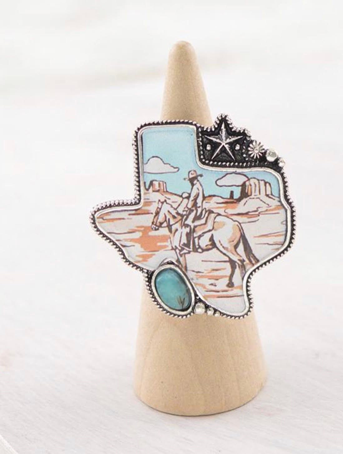 Cowboy rides away ring